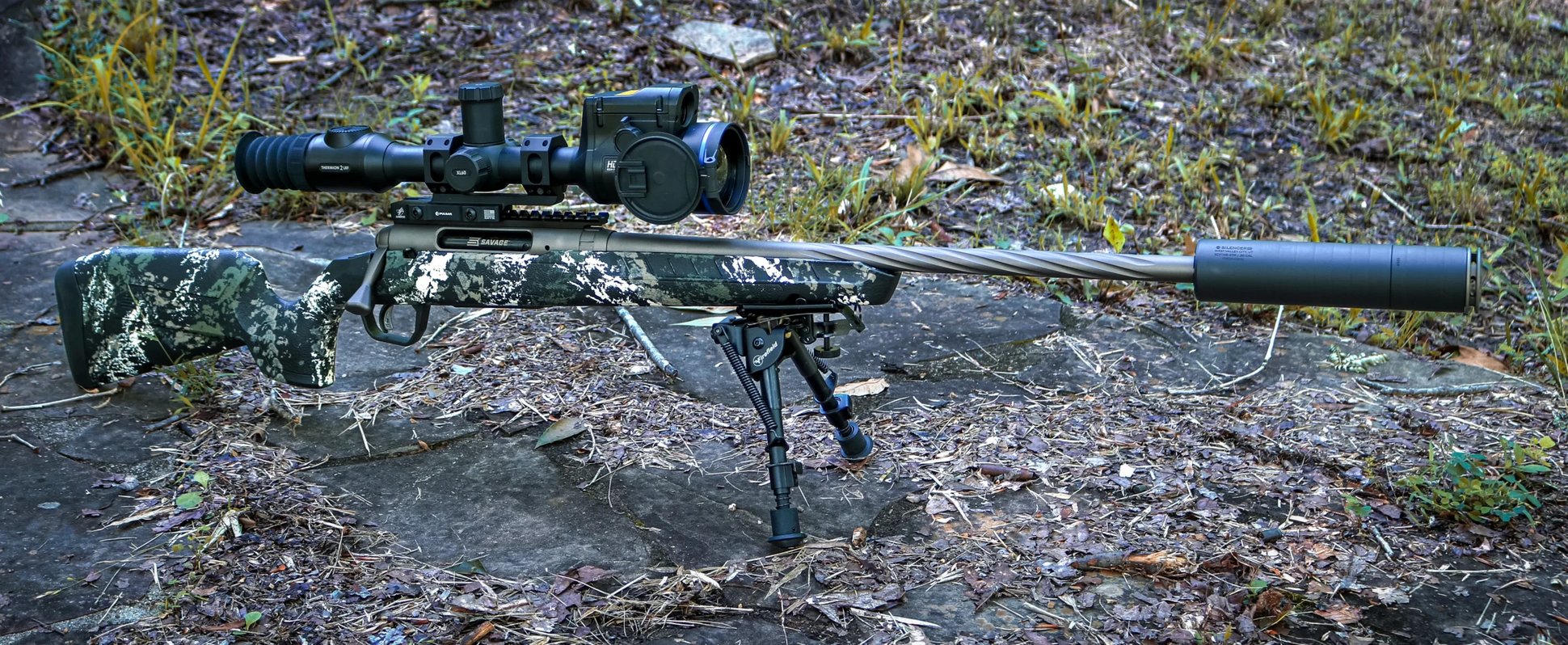 A Savage Axis 2 Pro rifle fitted with a SilencerCo Scythe STM suppressor and a Pulsar Thermion 2 LRF XL60 thermal riflescope