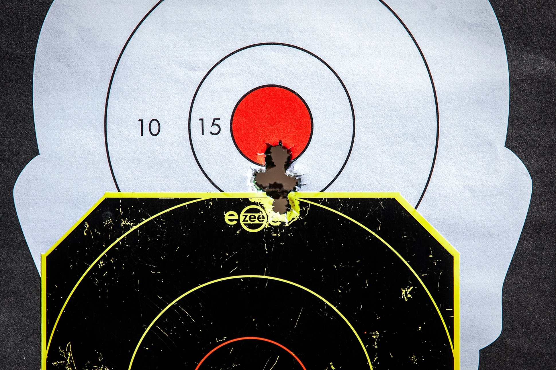 a target with a tight grouping of bullet holes