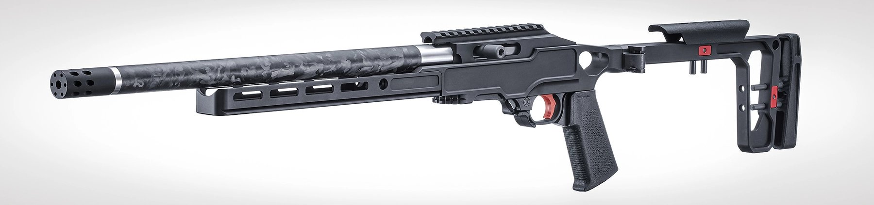 The Ruger 10/22 Carbon Rifle with a Black Anodized Grey Birch Chassis stock