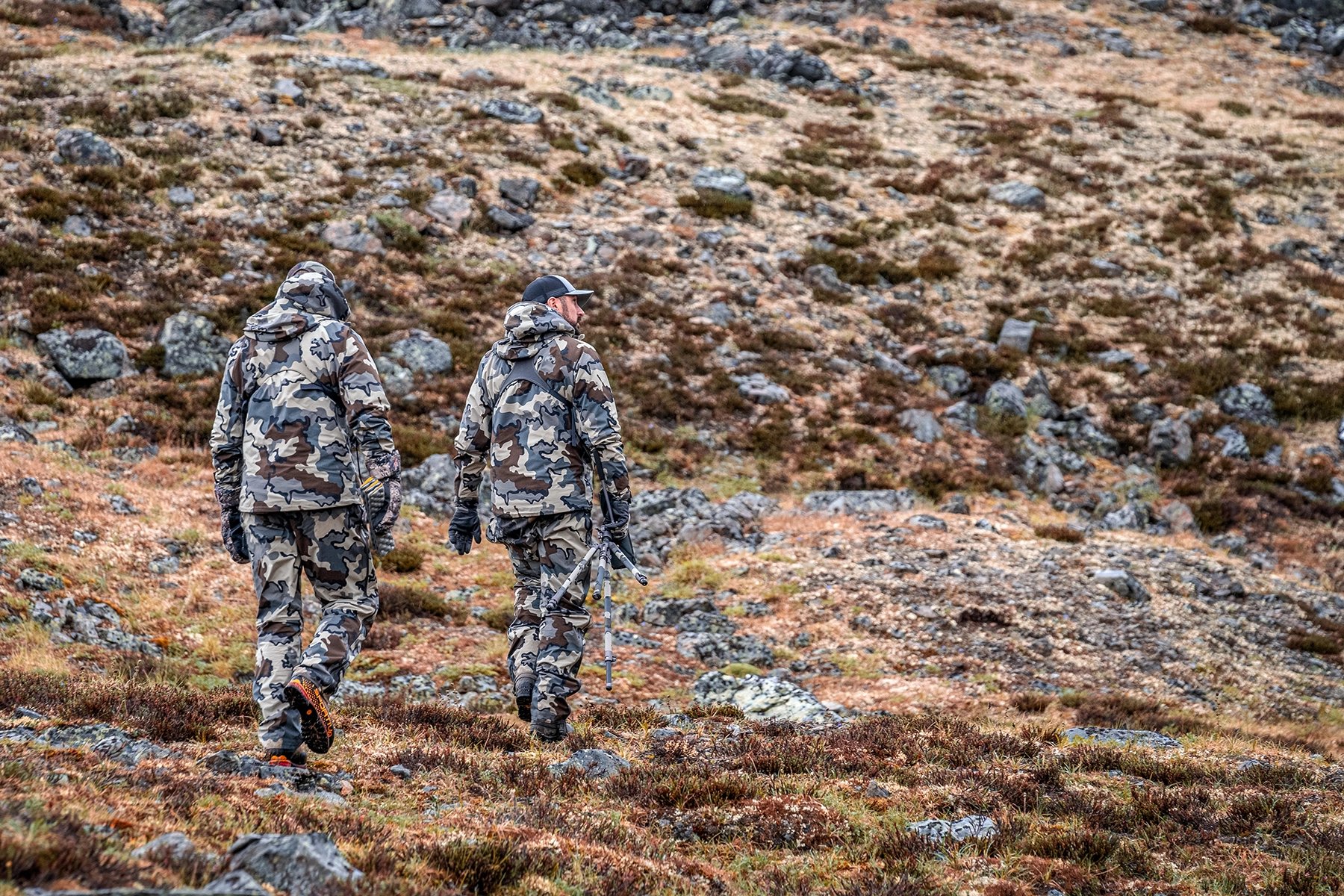 two hunters walking