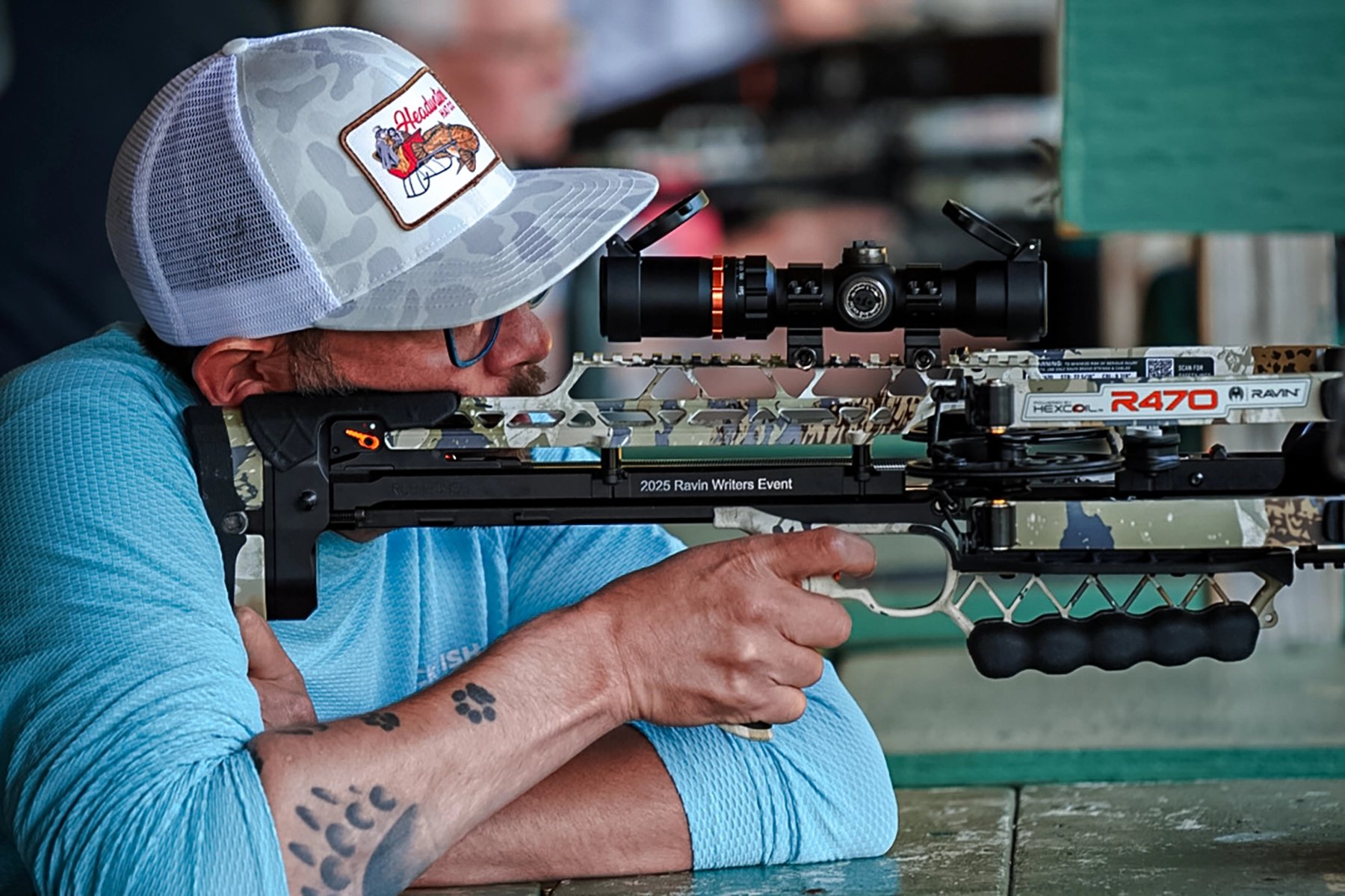 the author shooting a Ravin R470 crossbow from a bench