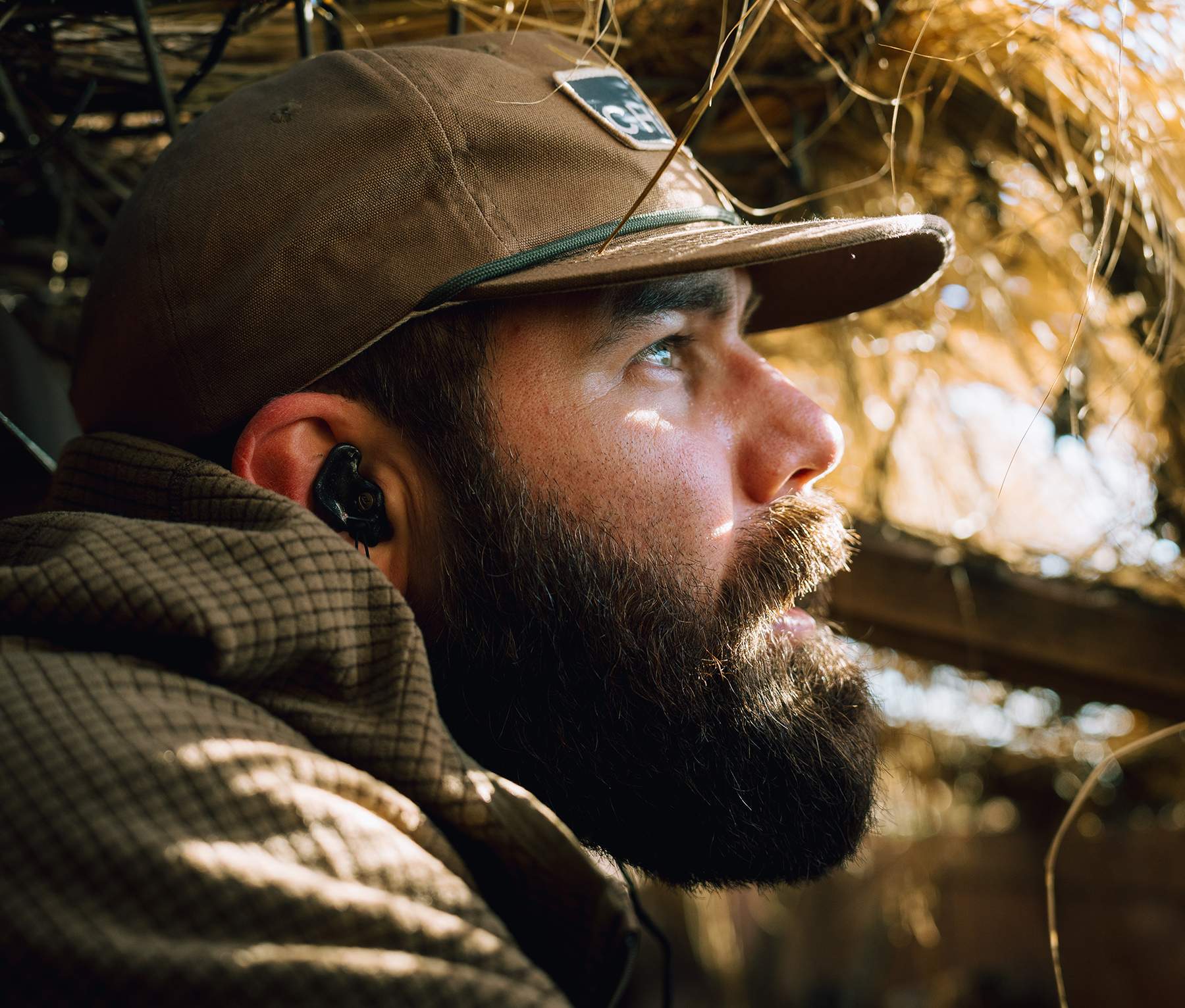Jordan Davis peers out of a duck blind