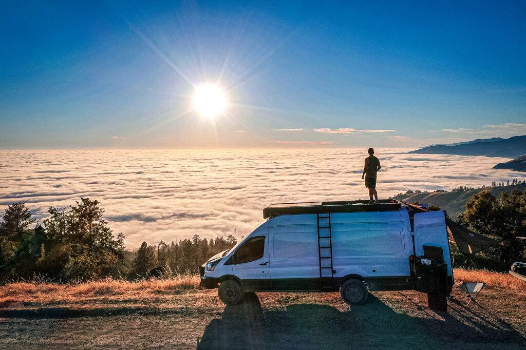 conversion van in front of sun and clouds