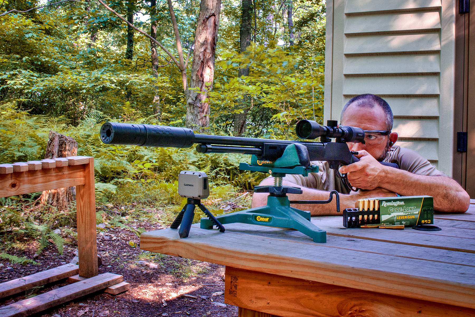 the author firing a Henry Model X Rifle with a SilencerCo suppressor and Remington Core-Lokt .360 Buckhammer