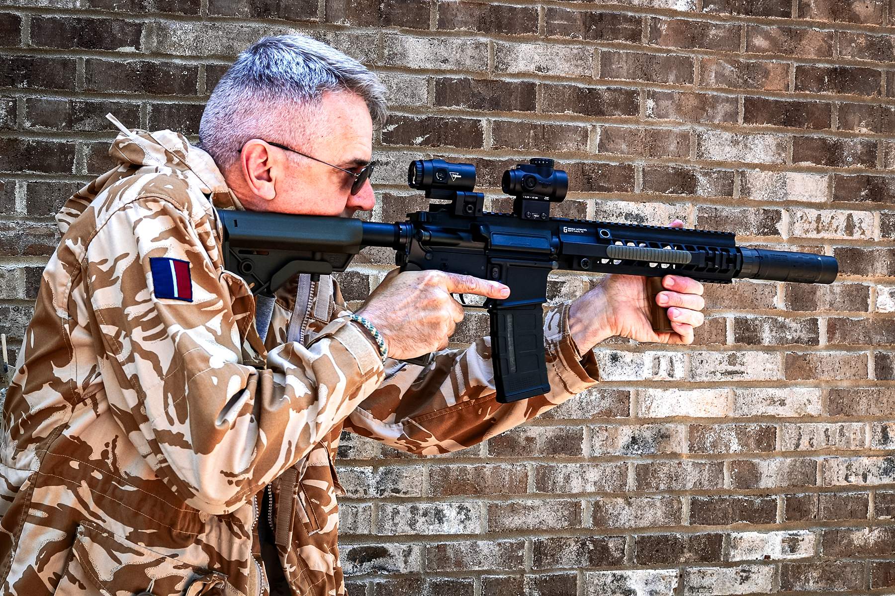 the author with the Trijicon MRO SD with magnifier on an AR
