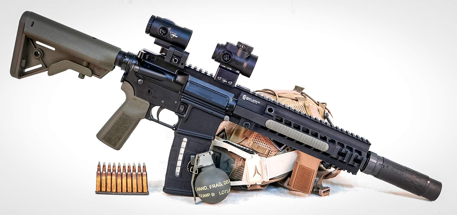 Trijicon MRO SD with magnifier on an AR with ammo and a grenade