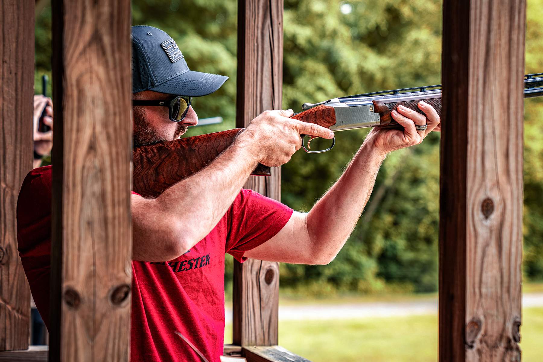Austin Dillon firing an over-under shotgun on the clays range
