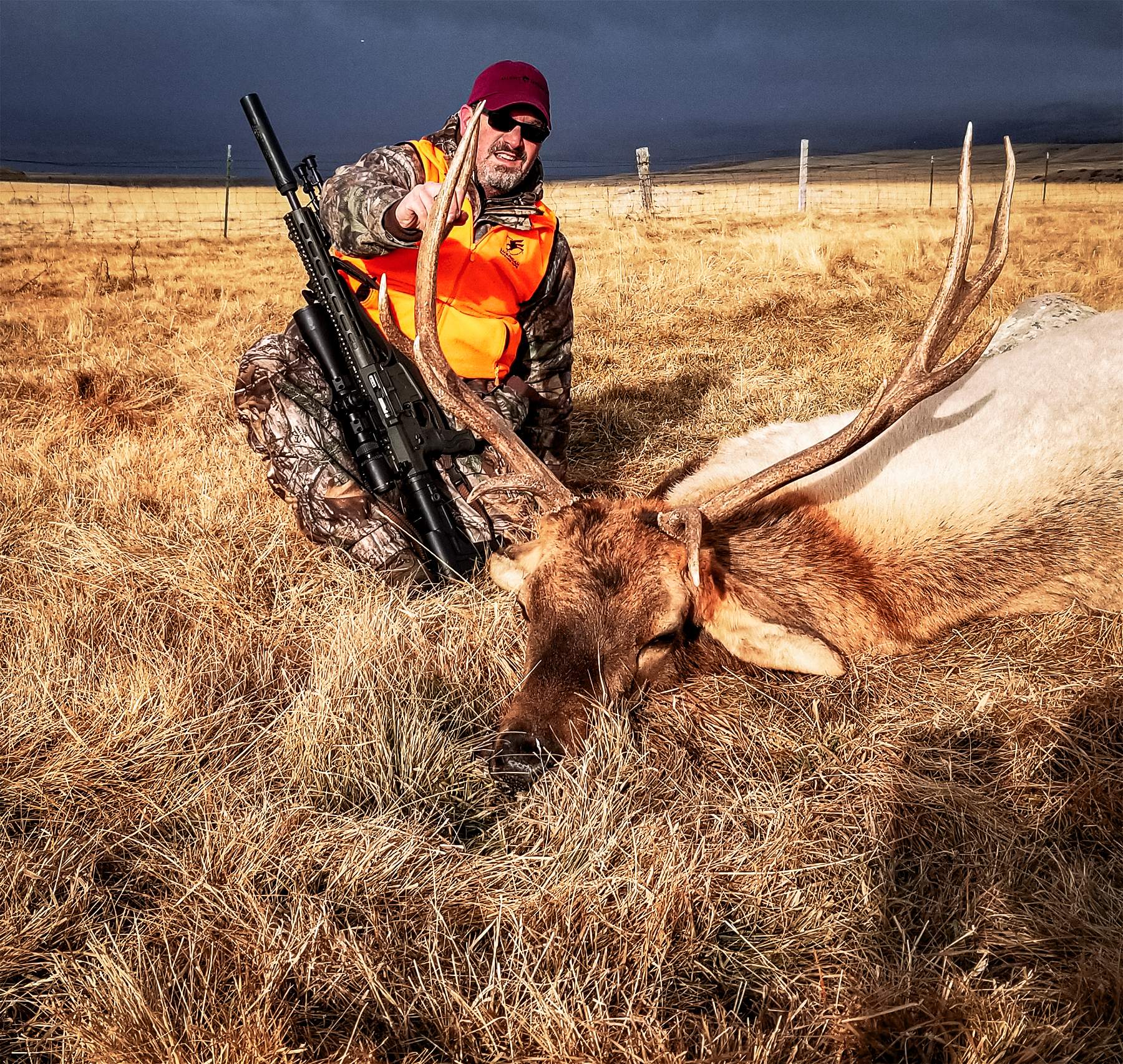 the author with a an elk hunted with a suppressor 