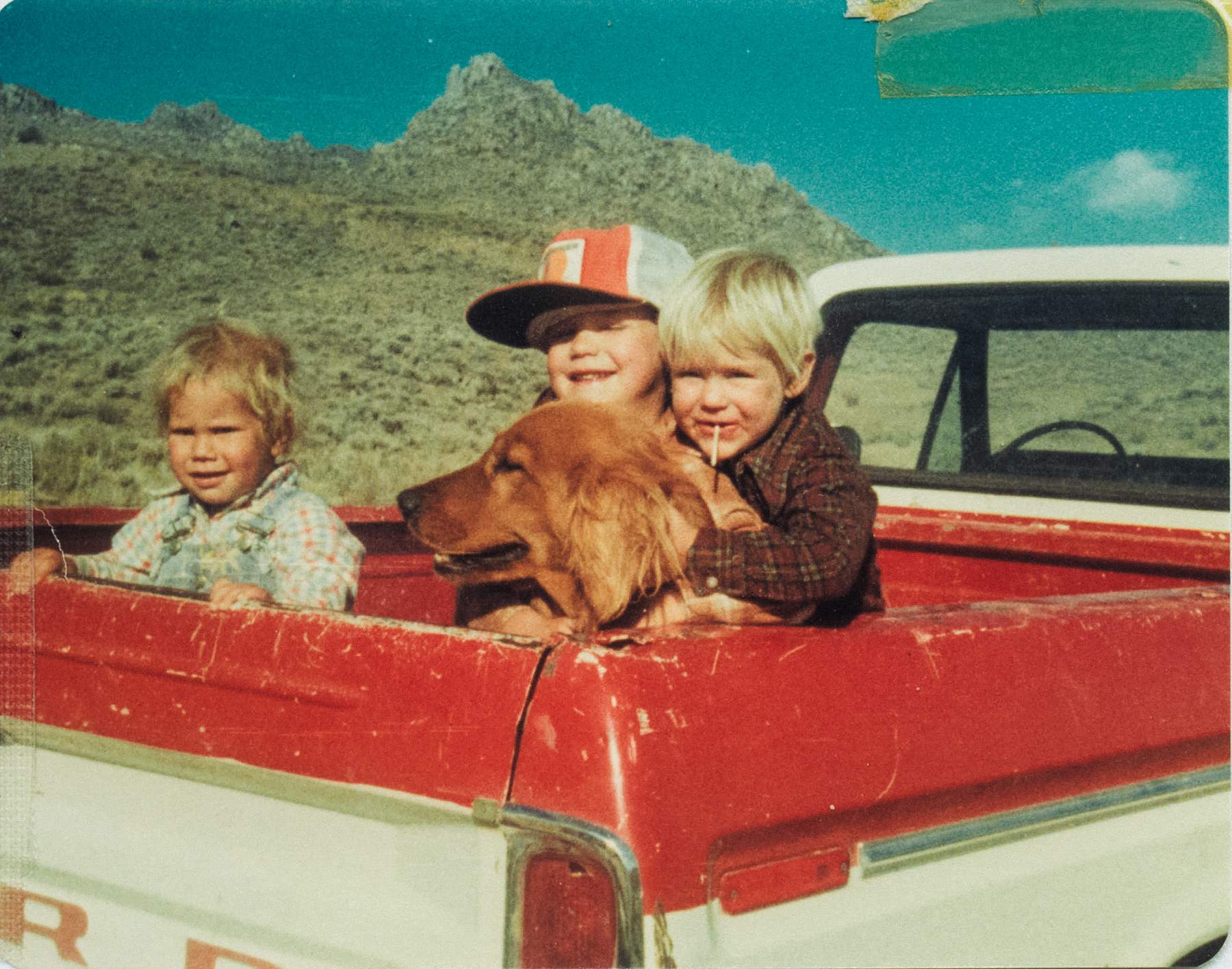 chad belding as a kid with his brothers and a dog in the back of a Ford pickup