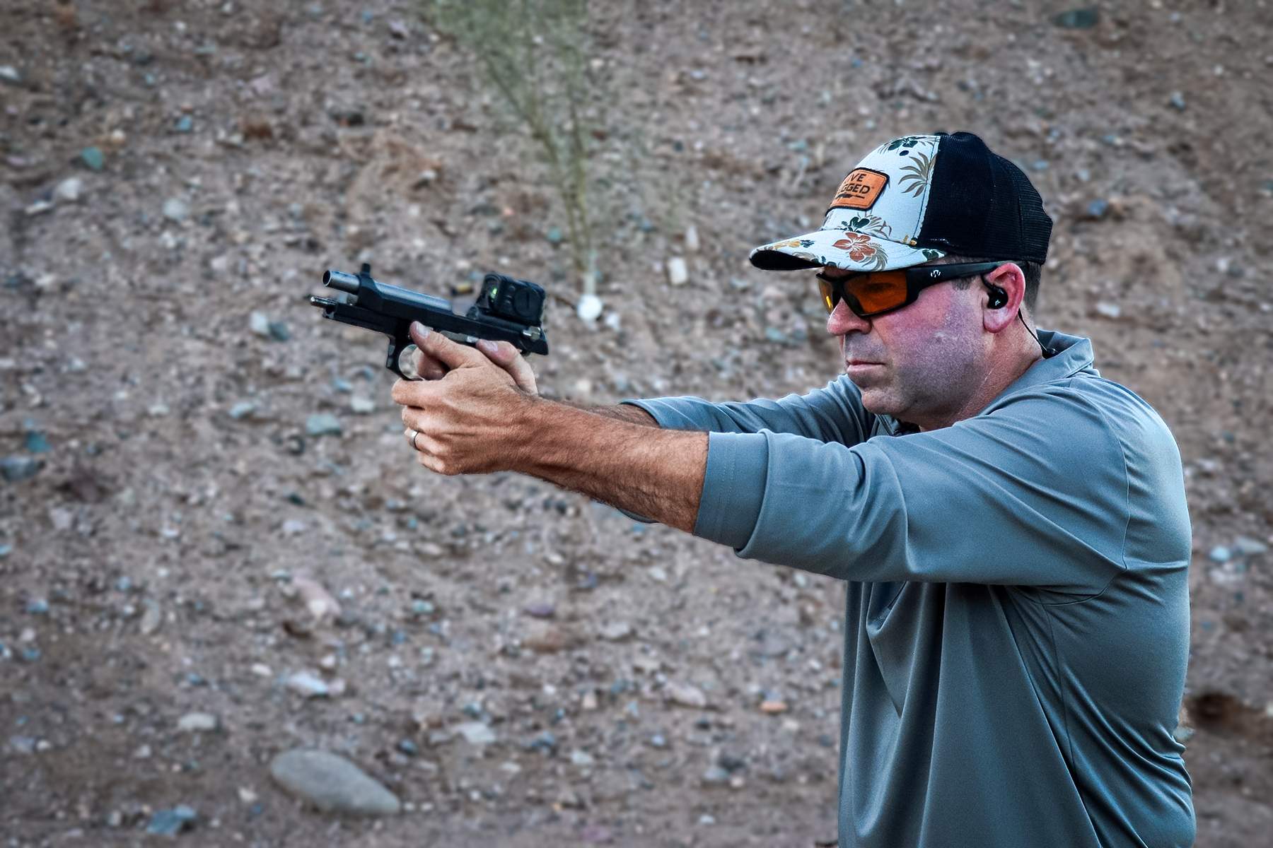 the author shooting the LTT Beretta 92G pistol
