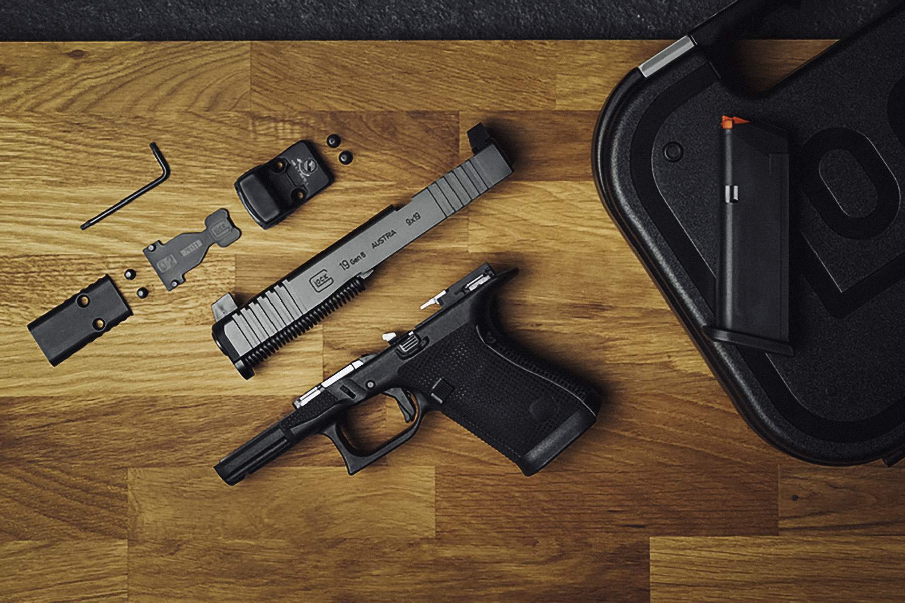 A GLOCK G19 Gen6 with the slide removed an optic assembly