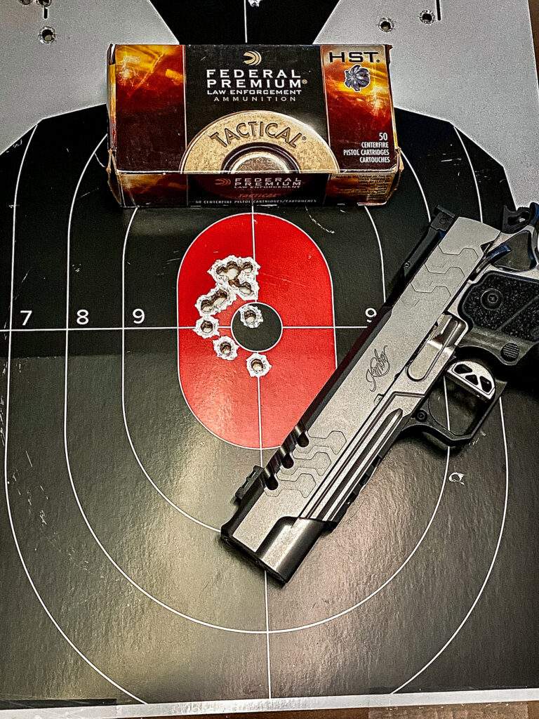 Kimber 2K11 Stainless Comp with Federal HST ammo and target