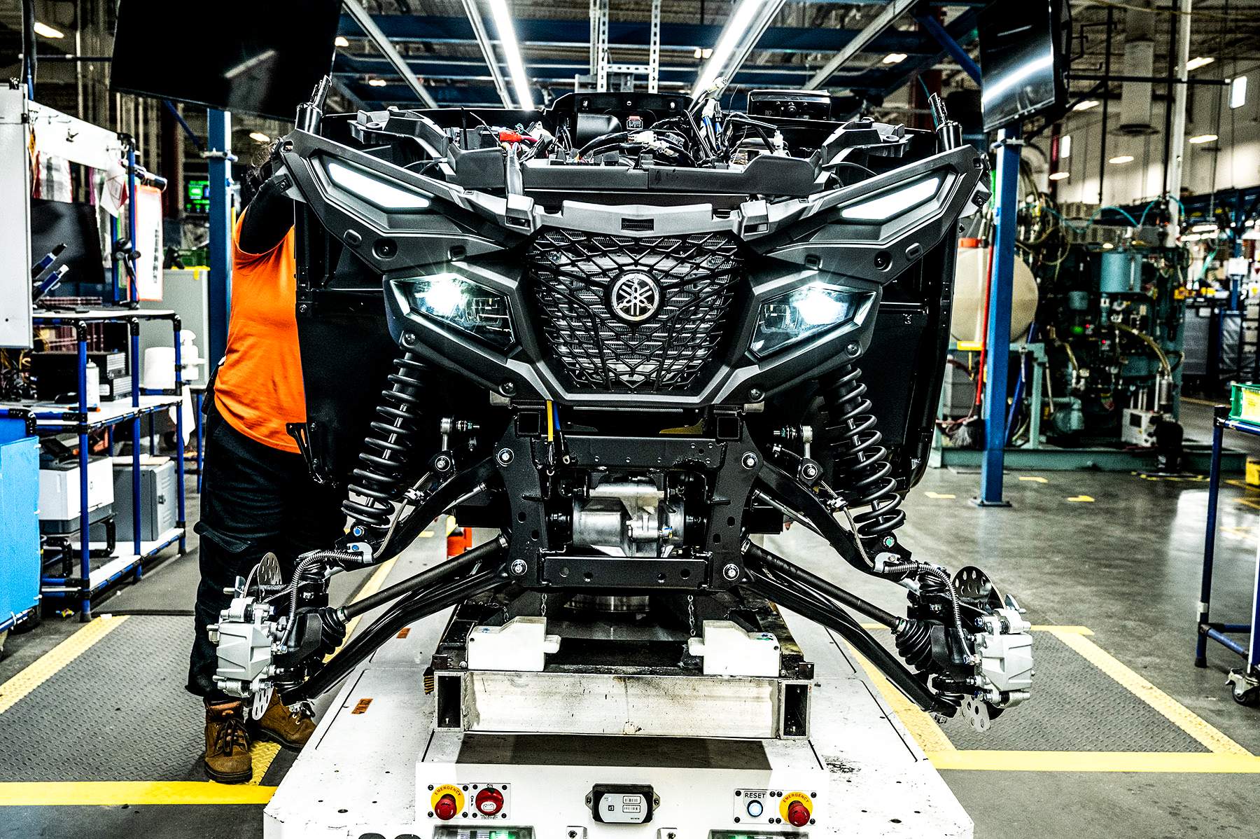 Yamaha assembly line partially constructed Grizzly with headlights on