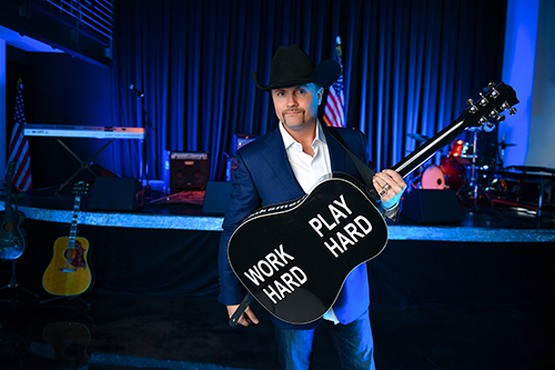 John Rich holding guitarJohn Rich: Building His Rich Legacy